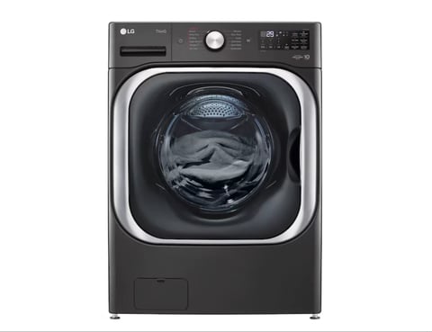 LG front-load washing machine with black exterior and illuminated circular drum door viewed from front