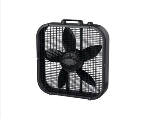 Black box fan with four large blades and protective grille, featuring a carry handle on top