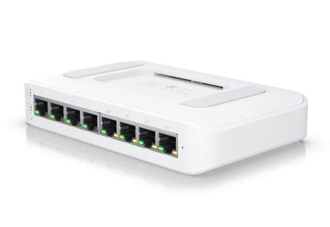 White network switch with eight ethernet ports and green LED indicators