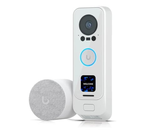 White video doorbell with camera and blue illuminated button next to speaker
