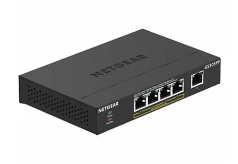 NETGEAR black network switch with 4 Ethernet ports and 1 SFP port on white background
