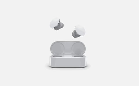 White and gray wireless earbuds with charging case on a light gray background