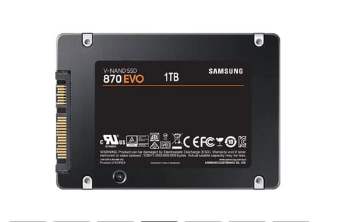 Samsung 870 EVO 1TB SSD with M.2 interface, showing gold connector pins and regulatory markings on dark back panel