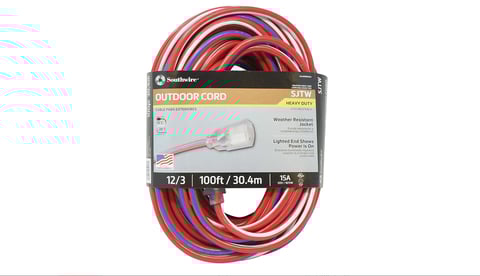 Coiled outdoor extension cord with red and blue striping, labeled 12/3 100ft, displayed with product packaging