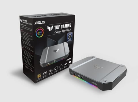 ASUS TUF Gaming laptop capture dock with black retail box and silver metal device featuring RGB lighting