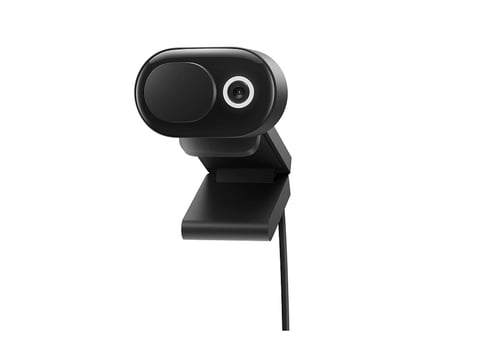 Black webcam with lens cover and adjustable mount on white background