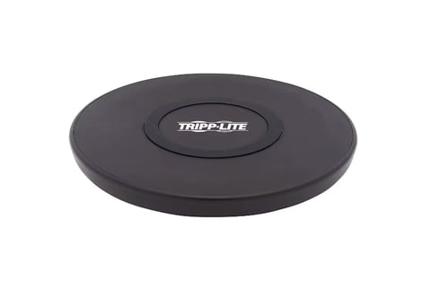 Black circular Tripp Lite wireless charging pad viewed from above against white background