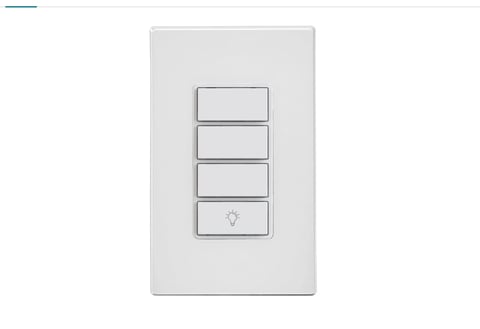 Light switch plate with four toggle switches on white background