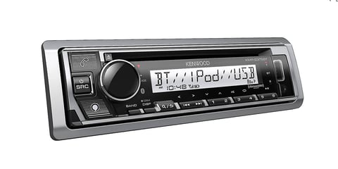 Kenwood car stereo head unit with digital display showing iPod playback, featuring control knobs and buttons