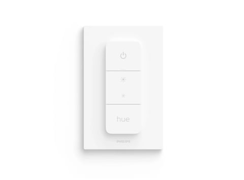 White Philips Hue wireless dimmer switch with power button and brightness controls on wall mount