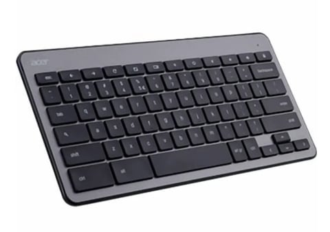 Compact wireless keyboard with gray and black keys on white background
