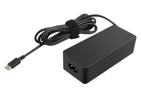 Black USB-C power adapter with coiled cable on white background