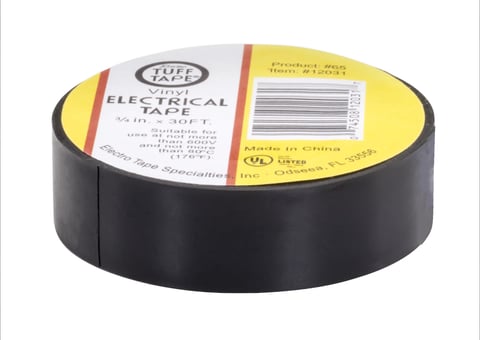 Roll of black electrical tape with yellow and white product label showing specifications and barcode.