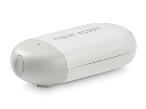 White Flood Alert water sensor device, cylindrical shape with one rounded end and branding visible on the side