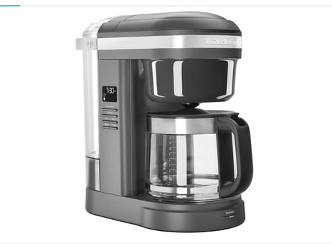 Bosch drip coffee maker with black and stainless steel design, digital display, and glass carafe