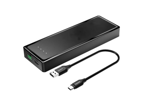 Black portable power bank with LED indicator lights and USB cables attached for charging devices