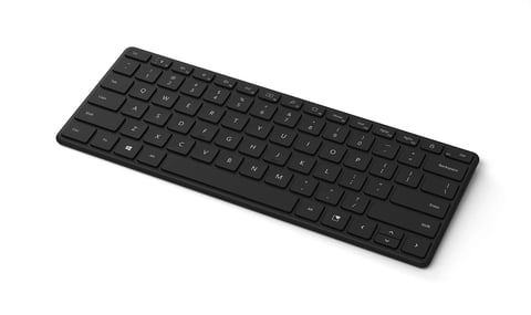 Sleek black wireless keyboard with compact design on white background