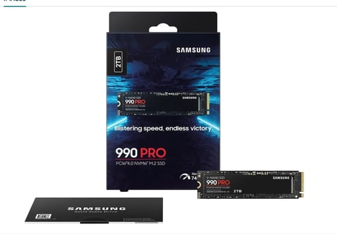 Samsung 990 PRO NVMe SSD retail packaging with internal drive displayed alongside the box