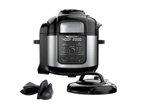 Black and stainless steel electric pressure cooker with digital display showing 400F and 20 minutes, with detachable lid beside it