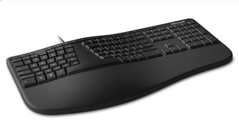 Black ergonomic keyboard with split key layout and cushioned wrist rest on white background