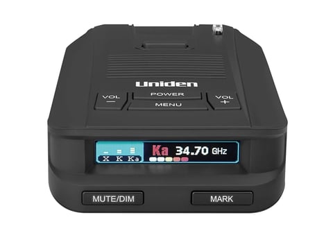 Uniden radar detector with digital display showing 34.70 GHz frequency and control buttons
